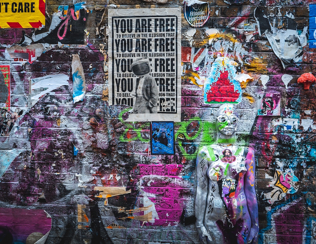 Image of a wall covered in graffiti